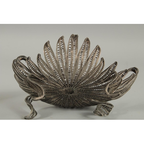 236 - A TURKISH WHITE METAL FILIGREE BASKET, with central tughra, basket raised on four curving feet, 23.5... 