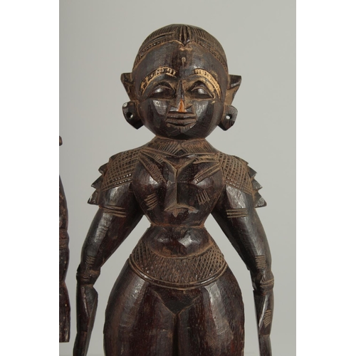 237 - TWO 19TH CENTURY SOUTH INDIAN -POSSIBLY TAMIL NADU CARVED WOOD FIGURES, 32cm and 30cm high.