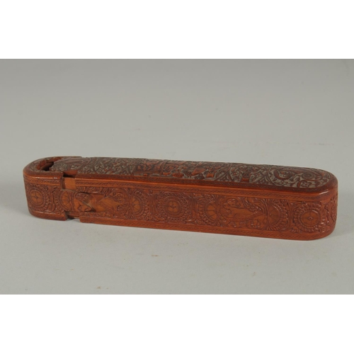 242 - A FINE 19TH CENTURY PERSIAN QAJAR ABADEH CARVED WOODEN QALAMDAN PEN BOX, 21cm long.