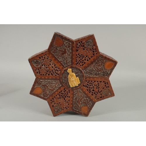 243 - A FINE 19TH CENTURY PERSIAN QAJAR ABADEH CARVED WOOD STAR-SHAPE BOX, the lid with carved and pierced... 