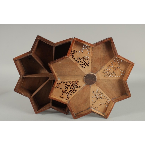 243 - A FINE 19TH CENTURY PERSIAN QAJAR ABADEH CARVED WOOD STAR-SHAPE BOX, the lid with carved and pierced... 