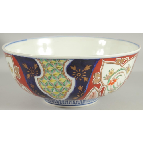 25 - A LARGE JAPANESE IMARI PORCELAIN BOWL, painted with various foliate motifs and gilt highlights, char... 