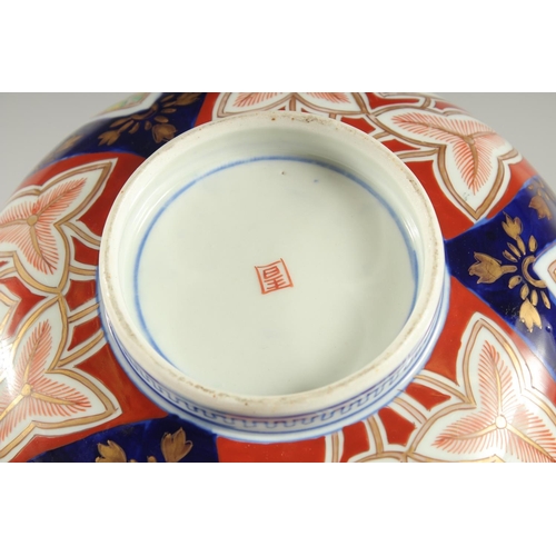 25 - A LARGE JAPANESE IMARI PORCELAIN BOWL, painted with various foliate motifs and gilt highlights, char... 