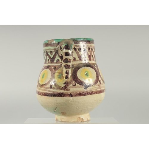 254 - AN 18TH CENTURY MOROCCAN OR TUNISIAN (QALLALIN) POTTERY TWIN HANDLED VASE, 18cm high.