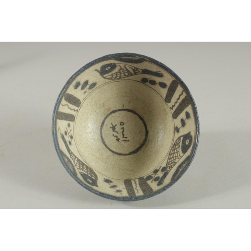 255 - A 19TH CENTURY PERSIAN QAJAR SIGNED AND DATED POTTERY BOWL, 15cm high.