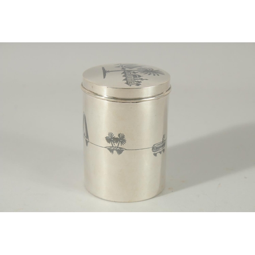 256 - A FINE IRAQI NIELLO INLAID SILVER LIDDED CYLINDRICAL BOX; possibly a tea caddy, 9cm high.