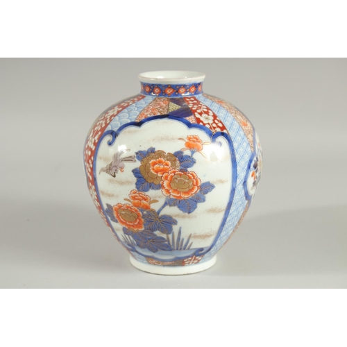 26 - A FINE JAPANESE IMARI PORCELAIN BULBOUS VASE, beautifully painted with panels of birds and native fl... 