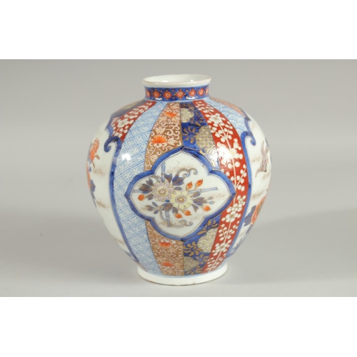 26 - A FINE JAPANESE IMARI PORCELAIN BULBOUS VASE, beautifully painted with panels of birds and native fl... 