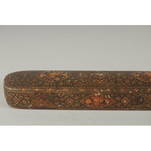 260 - A FINE MID-19TH CENTURY INDO PERSIAN KASHMIRI LACQUERED PAPIER-MACHE QALAMDAN PEN BOX, 25cm long.