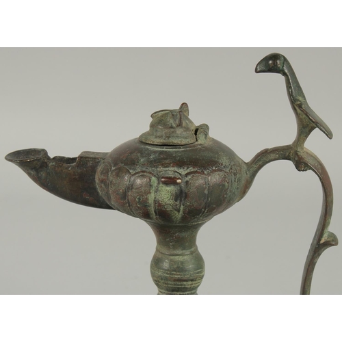 269 - A 13TH CENTURY PERSIAN SELJUK KHURASAN BRONZE OIL LAMP, 19cm high.