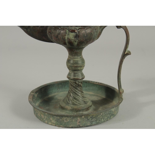 269 - A 13TH CENTURY PERSIAN SELJUK KHURASAN BRONZE OIL LAMP, 19cm high.