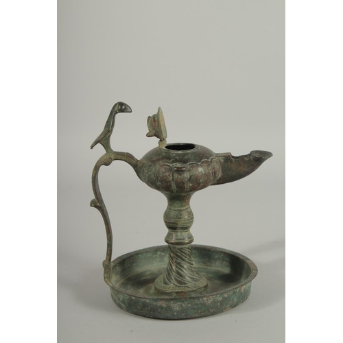 269 - A 13TH CENTURY PERSIAN SELJUK KHURASAN BRONZE OIL LAMP, 19cm high.