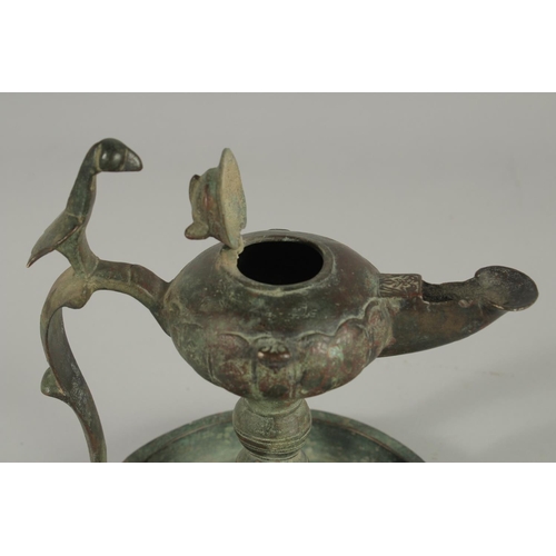 269 - A 13TH CENTURY PERSIAN SELJUK KHURASAN BRONZE OIL LAMP, 19cm high.