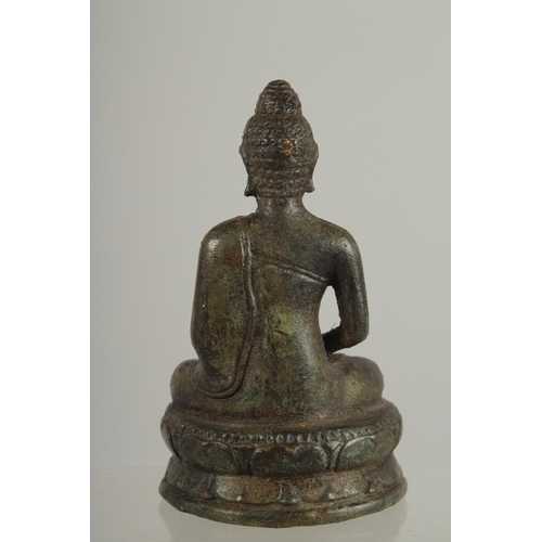 273 - AN EARLY SOUTH EAST ASIAN BRONZE BUDDHA, 12.5cm high.