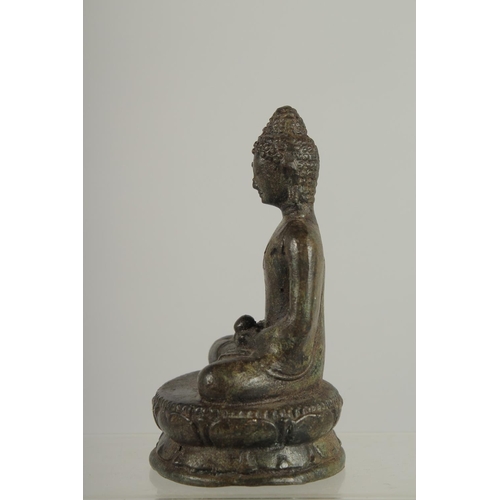 273 - AN EARLY SOUTH EAST ASIAN BRONZE BUDDHA, 12.5cm high.