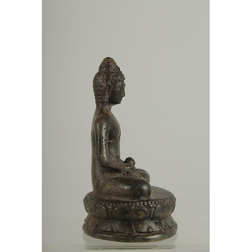 273 - AN EARLY SOUTH EAST ASIAN BRONZE BUDDHA, 12.5cm high.