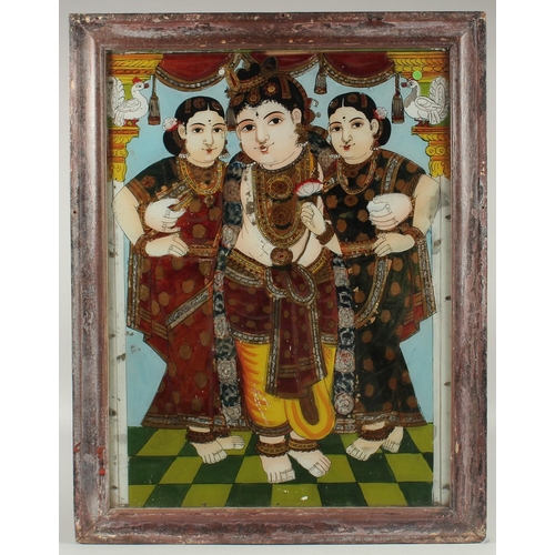 285 - A LARGE 19TH CENTURY SOUTH INDIAN TANJORE REVERSE GLASS PAINTING OF KRISHNA, 68.5cm x 53.5cm.