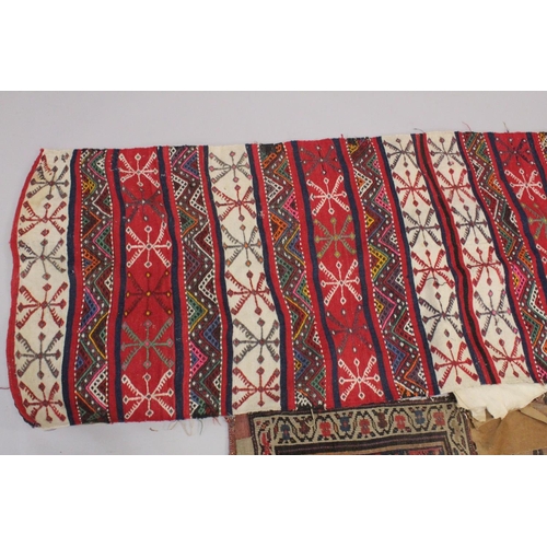 288 - THREE PERSIAN SADDLE BAGS AND RUGS.