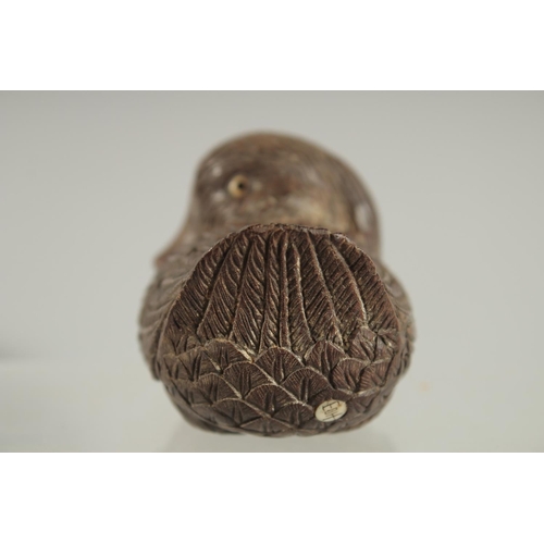 29 - A CHINESE CARVED WOOD FIGURE OF A DUCK, with inset bone character mark, 9cm long.