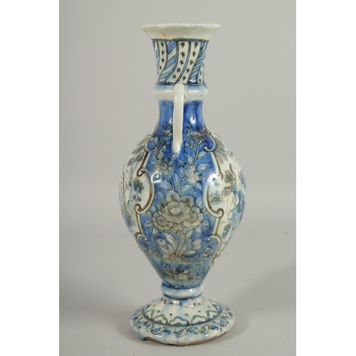 293 - A 19TH CENTURY PERSIAN QAJAR GLAZED POTTERY VASE, with twin handles and painted with a panelto each ... 