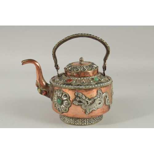 299 - A SRI LANKAN COPPERED METAL EWER, with mounted dragons and stones.