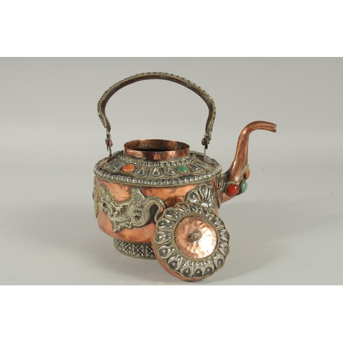 299 - A SRI LANKAN COPPERED METAL EWER, with mounted dragons and stones.