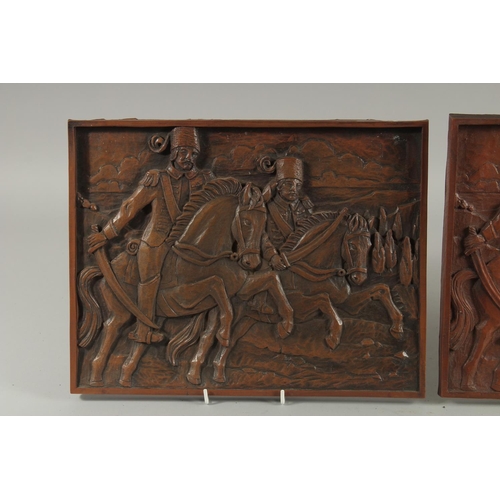 301 - A PAIR OF OTTOMAN CARVED WOOD PLAQUES, 27cm x 35cm.