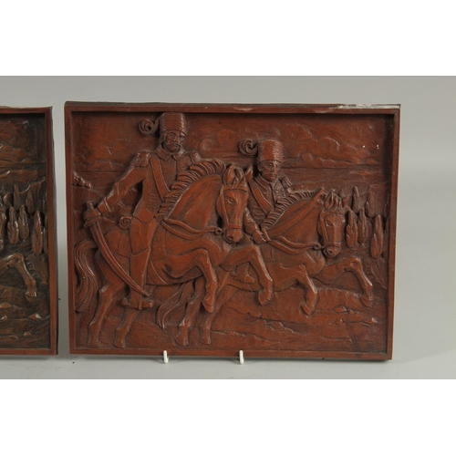 301 - A PAIR OF OTTOMAN CARVED WOOD PLAQUES, 27cm x 35cm.