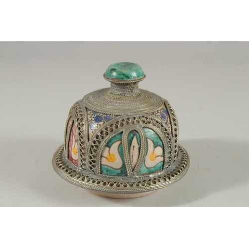 303 - A MOROCCAN METAL MOUNTED POTTERY LIDDED JAR, the jar painted with foliate motifs, 37cm high.