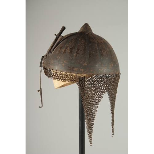 305 - A QAJAR GOLD DAMASCENED STEEL HELMET, with retractable nose guard and chain mail neck skirt, the int... 