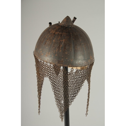 305 - A QAJAR GOLD DAMASCENED STEEL HELMET, with retractable nose guard and chain mail neck skirt, the int... 