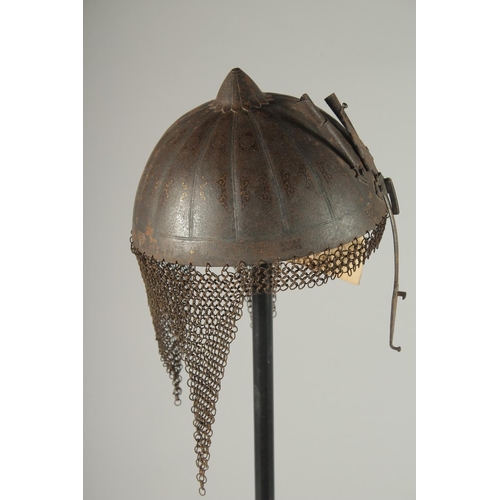 305 - A QAJAR GOLD DAMASCENED STEEL HELMET, with retractable nose guard and chain mail neck skirt, the int... 