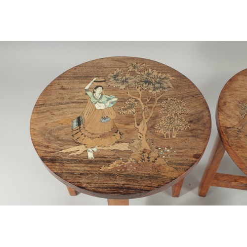 31 - A PAIR OF BONE INLAID WOODEN STOOLS, each depicting a female figure carrying a vessel of water, 30cm... 