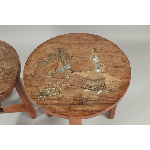 31 - A PAIR OF BONE INLAID WOODEN STOOLS, each depicting a female figure carrying a vessel of water, 30cm... 