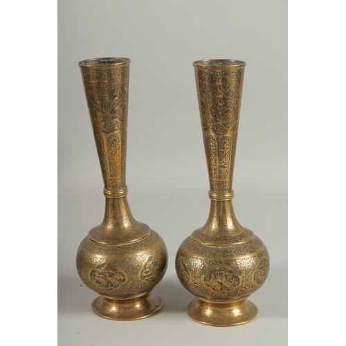 313 - A PAIR OF QAJAR ENGRAVED BRASS BOTTLE VASES, decorated with various panels of birds and flora, 28cm ... 