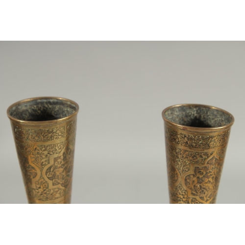 313 - A PAIR OF QAJAR ENGRAVED BRASS BOTTLE VASES, decorated with various panels of birds and flora, 28cm ... 