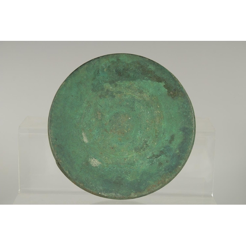 316 - A SMALL ISLAMIC BRASS DISH, 15cm diameter.