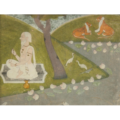 331 - AN 18TH CENTURY INDIAN PAHARI MINIATURE PAINTING, depicting a sadhu meditating by a river, framed an... 