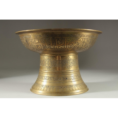 341 - A RARE EARLY ISLAMIC MAMLUK SILVER INLAID BRASS FOOTED BOWL / TRAY STAND, with engraved panels of ca... 