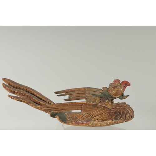 348 - AN 18TH-19TH CENTURY SOUTH EAST ASIAN LACQUERED CARVED WOODEN PHOENIX, possibly Thai, 30cm long.