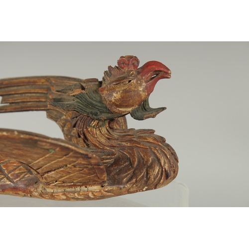 348 - AN 18TH-19TH CENTURY SOUTH EAST ASIAN LACQUERED CARVED WOODEN PHOENIX, possibly Thai, 30cm long.