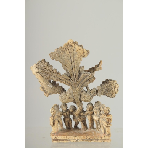 349 - A FINE 17TH-18TH CENTURY SOUTH INDIAN CARVED BONE FLUTING KRISHNA UNDER TREE, 10.5cm high.