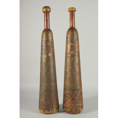 360 - A RARE PAIR OF 19TH CENTURY PERSIAN QAJAR LACQUERED WOODEN EXERCISE CLUBS, 62cm long.