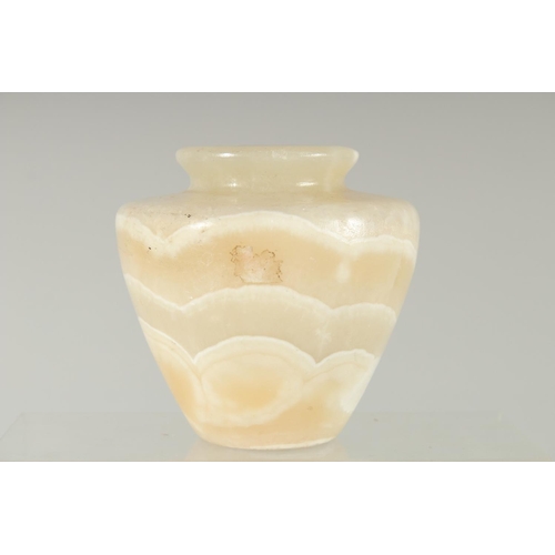 364 - AN EGYPTIAN CARVED ALABASTER VASE, 11cm high.