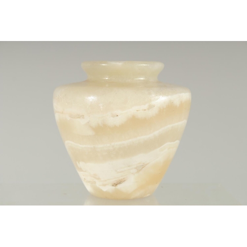 364 - AN EGYPTIAN CARVED ALABASTER VASE, 11cm high.