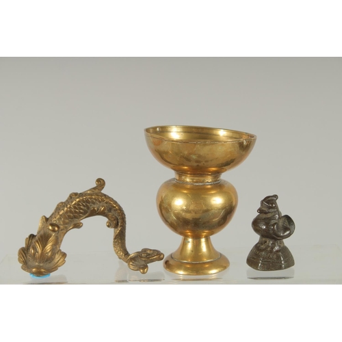 369 - A COLLECTION OF SEVEN BRASS OPIUM WEIGHTS, together with four other brass items, (11).