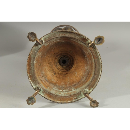 382 - AN UNUSUAL MIXED METAL ENAMELLED BRASS LAMP, with central brass overlaid coconut, the circular base ... 