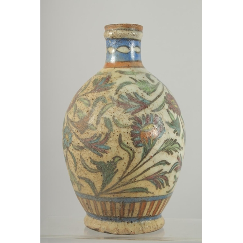 383 - AN IZNIK GLAZED POTTERY BOTTLE VASE, painted with a deer and flora, 21cm high.