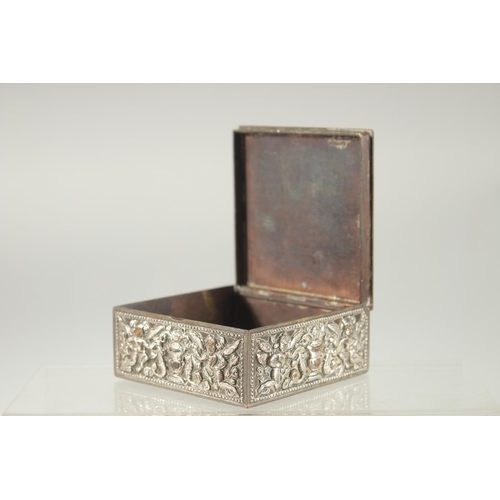 387 - AN INDIAN SILVER OVERLAID SQUARE BOX, with hinged lid and relief decoration, 8cm square.