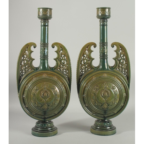 390 - A PAIR OF 19TH CENTURY GREEN HISPANO-MORESQUE GLAZED CERAMIC CANDLESTICKS / VASES, 60cm high.